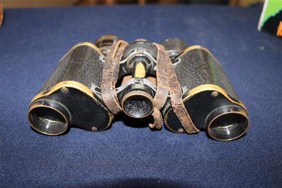 A pair of German WWI binoculars, two helmet straps and four pairs of Africa core goggles